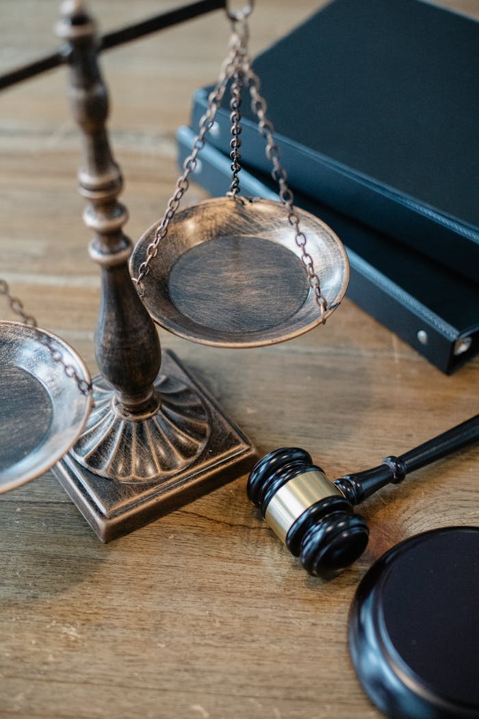 creative From above of judicial symbols consisting of Scales of Justice and small judge hammer with curly handle